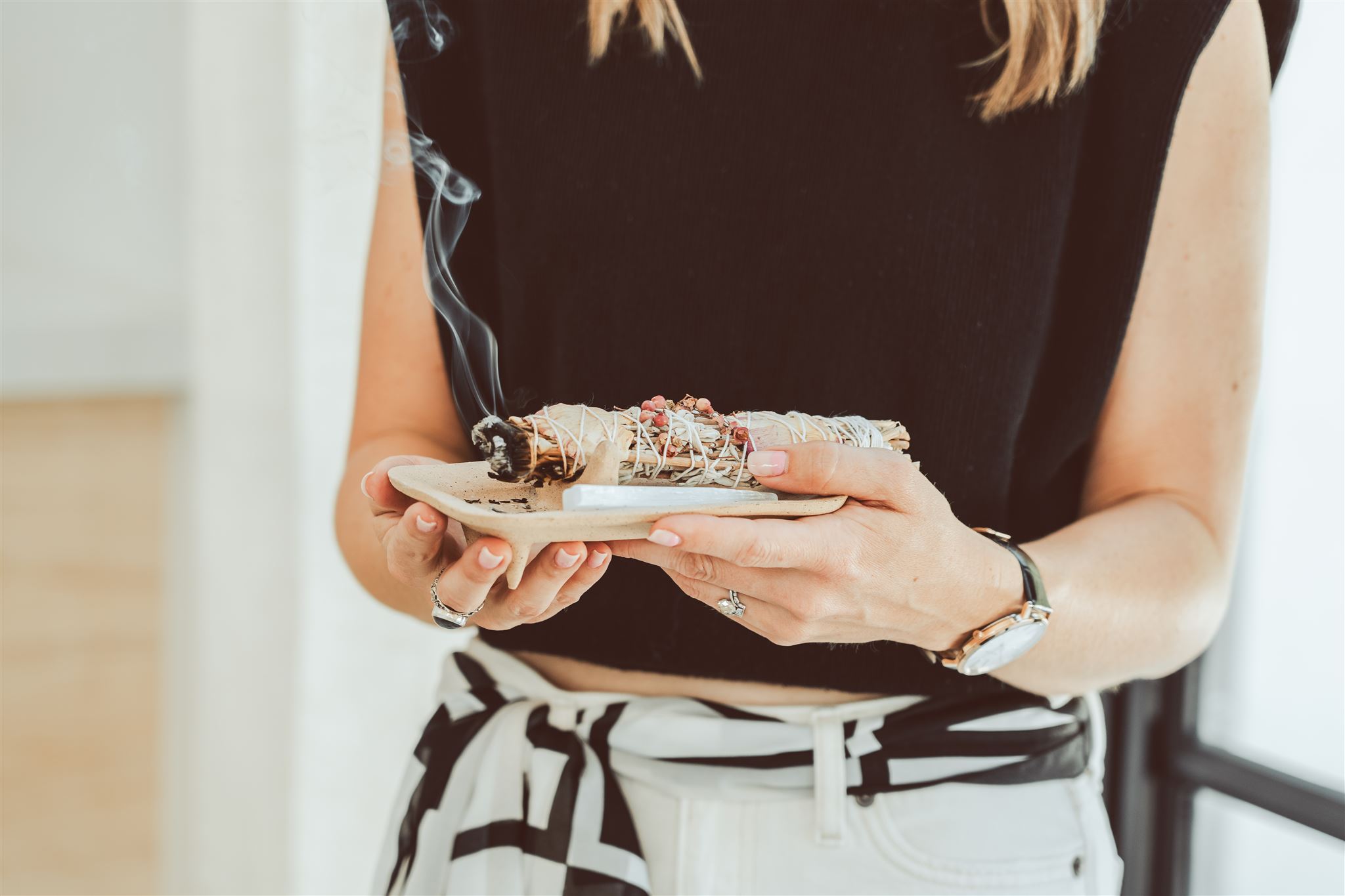 Image of Lexie holding sage on a plate.